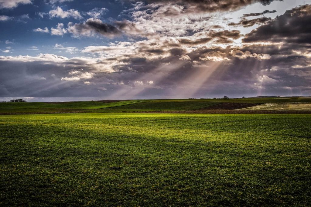 After the rain, the clouds break open and the sun appears in the form of sunrays