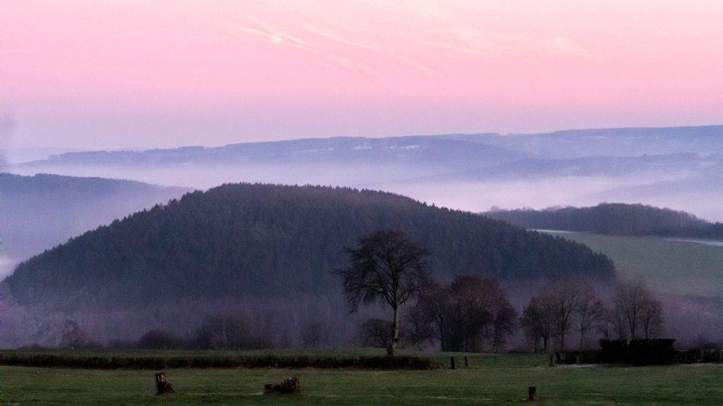 Landscape photo of evening mist coming up during a colder evening