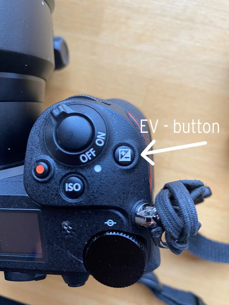 photo of camera showing the EV button