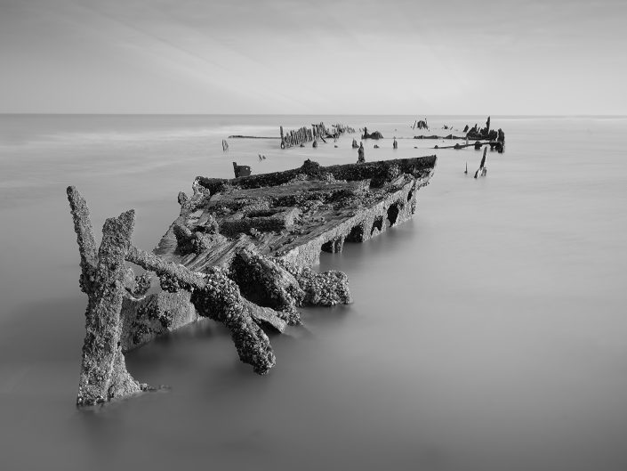 black and white long exposure photo of a shipwreck at the Opal Coast North France