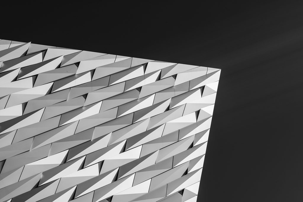 black and white architectural photo of the facade of the Titanic Museum in Belfast, Northern Ireland