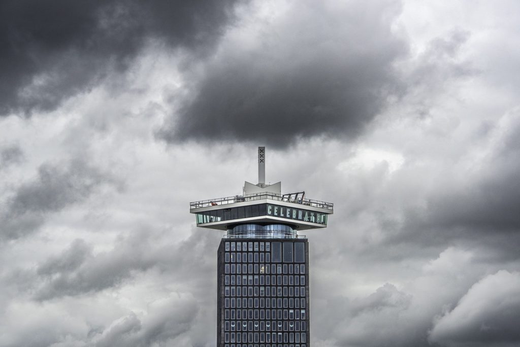 Minimal cityscape photo of a tower with lots of sky around it