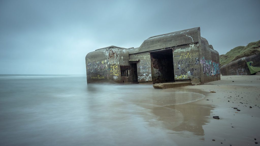 long exposure seascape photo of old bunker at the coast of Denmark