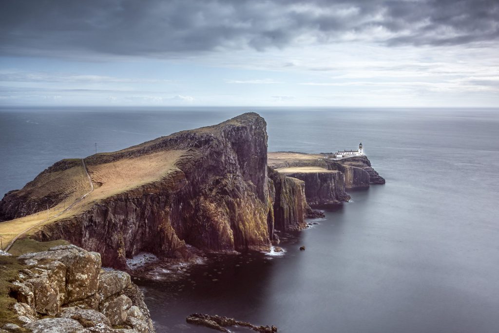 long exposure seascape photo of Neist point, Isle of Skye with a lighthouse in the distance