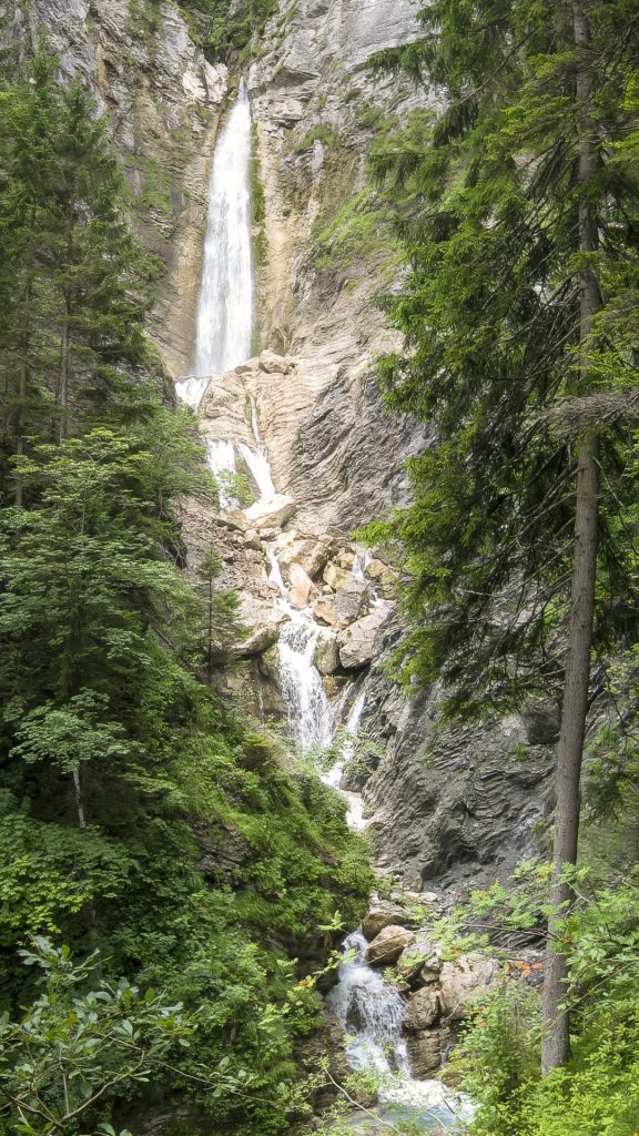 "Whispering Cascade" offers a glimpse into the untouched splendour of nature, depicting a multi-tiered waterfall slicing through a densely wooded cliffside. The vertical frame accentuates the waterfall's towering journey, surrounded by the emerald embrace of ancient trees. This scene beautifully captures the interplay between water and rock, creating a dynamic yet serene natural tableau that invites contemplation. The vertical composition effectively underscores the height and grandeur of the cascade, while the lush greenery frames the scene, enhancing its depth. I did not have a wide-angle lens then, so I had to make this panorama from 2 photos.