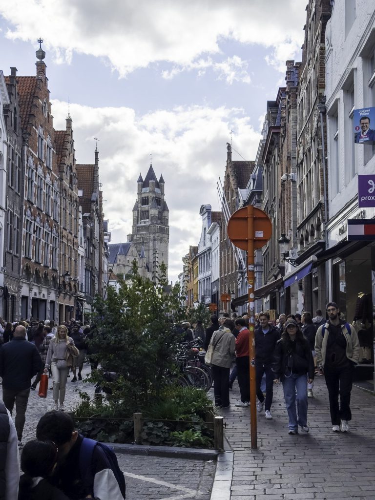 Cityscape in Brugge, with a lot of disturbances created by traffic signs, shop sings and pedestrians.